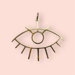 Gold eye charm