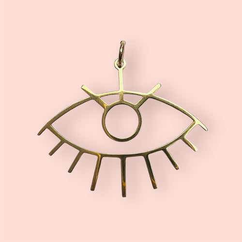 Gold eye charm